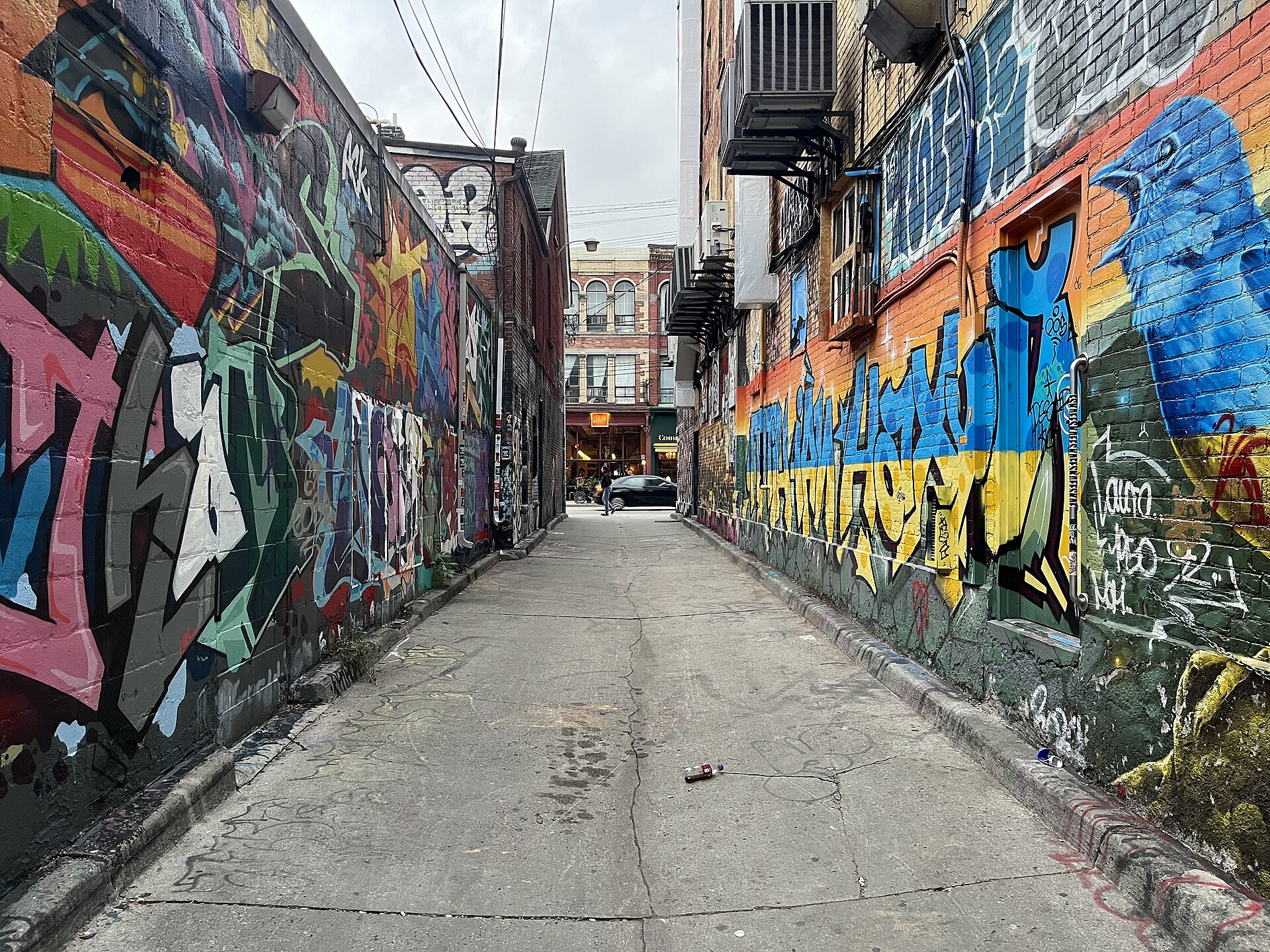 Painted walls on both sides of Toronto's Graffiti Alley